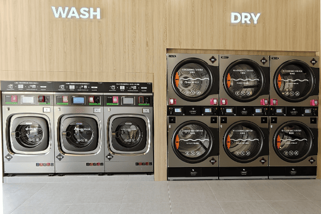 oasis-student-housing-laundry-room-commercial-washer-dryer.png